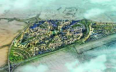 Aerial view of a large, well-planned residential community development with villas and green spaces (JVC or JVT area). Local home movers serving Jumeirah Village Circle and Triangle by dxbmovershub.com.